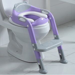 Brand new, in the box never opened potty training seat with “ladder.”